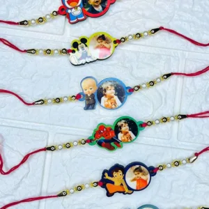 Personalized Mickey Mouse acrylic photo rakhi featuring a custom child photo with pearl and gold bead detailing on a soft red thread for kids.