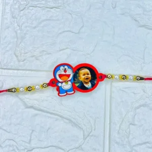 Personalized Mickey Mouse acrylic photo rakhi featuring a custom child photo with pearl and gold bead detailing on a soft red thread for kids.