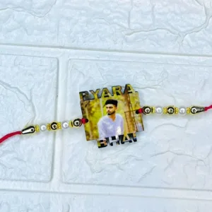 Personalized acrylic photo rakhi with "Pyara Bhai" text, custom printed brother photo, pearl and gold bead design with premium red thread for Raksha Bandhan.