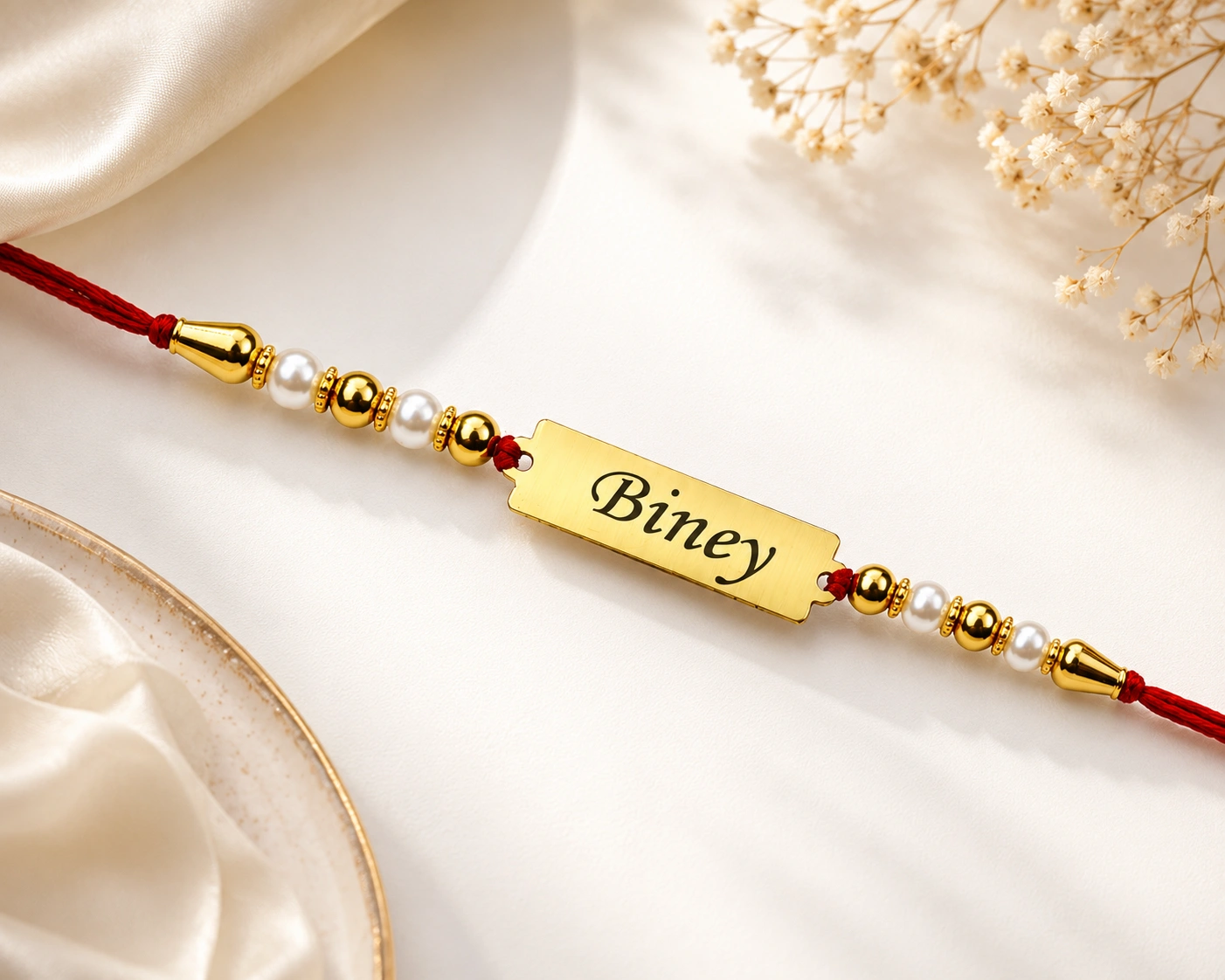 55bb2b33-4611-42bb-b8a1-7f22749a9ee0 personalized gold bar name rakhi, personalized name rakhi, custom name rakhi, gold name rakhi, personalized rakhi, customized rakhi, custom rakhi, engraved rakhi